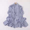 Close-up of a light blue satin headscarf hanging on a wooden hanger with smooth texture - Light Blue