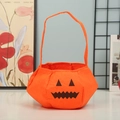 Orange felt Halloween pumpkin candy bag with black jack-o'-lantern face for kids - Pumpkin Bag E