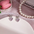 Boucles d'oreilles cœur en cristal rose avec nœud argenté et perles élégantes - Noeud de Coeur Rose