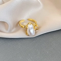 Macro detail of golden irregular pearl ring with side crystal accents on silk - Irregular Waterdrop Pearl Style (3 Rings-Gold)