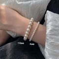 Detail of 10mm and 4mm pearl elastic bracelets worn on wrist with elegant luster - 4+10mm Pearl Bracelet Set