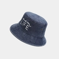 Detail of vintage washed denim bucket hat with white mom LIFE embroidery and metal eyelets - Navy Blue