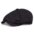 Side view of a black cotton newsboy cap with classic six-panel structure and top button - One Size / Black