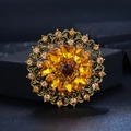 Vintage gold brooch with dark red center stone and amber heart crystals on black background - Dark & Light Coffee with Golden Yellow Acrylic Hollow Round