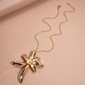 Detailed view of a layered gold floral pendant with irregular metallic petals and chain - Necklace / Gold