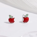 Macro shot of 925 sterling silver red apple earrings with green leaf on white background - Red Apple Earrings