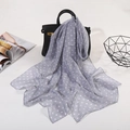 Light gray polka dot chiffon scarf tied on a handbag for a stylish summer look - Small Polka Dot Grey