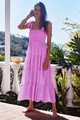 Pink bohemian floral sun dress featuring a smocked bodice and tiered ruffled hemline - Pink