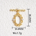 Detailed view of an 18K gold-plated oval pendant with scroll patterns and white zircons - Gold Vintage Engraved Zirconia Pendant