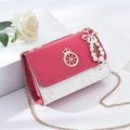 Red and white crossbody bag with gold chain strap and elegant pearl bow charm - With Pendant / Rose Red