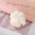 Creamy white cat paw scented soy candle with a paper tag for elegant home decor - Cream White (English Pear & Freesia)