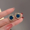 Square halo stud earrings with deep blue crystal and white cubic zirconia accents - Blue Square Zirconia Halo Studs