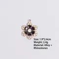 Detail view of black enamel flower charm with inlaid rhinestones measuring 1.9x2.4cm - Style 8 Flower / Gold