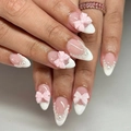 Elegant French press-on nails featuring cute pink bows and pearl accents on white tips - JP4318 Style