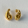 Textured gold teardrop stud earrings with hammered finish in minimalist organic style - Gold