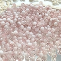 Macro shot of 10mm pink and white gradient crackle glass beads for DIY jewelry making - 8mm Semi-white Light Pink