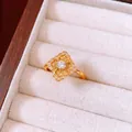 Vintage hollow flower ring with pavé crystals in gold plating shown in a wooden box - Vintage Hollow Floral Style