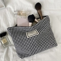 Close-up of houndstooth toiletry bag with zipper and Pleasant Time woven label - Black and White Houndstooth (White)