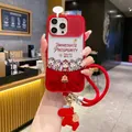 Close-up of New Year red iPhone case with cartoon motifs and decorative wrist strap - Pp Spring Festival * Red Lucky Five Horses * Single Shell / iPhone15