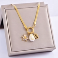 Detail of detachable heart shell and zircon pendants on a gold snake chain in a jewelry box - Petal Shell Style (Gold)