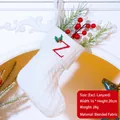 White knitted Christmas stocking with red letter Z embroidery and festive holly leaf detail - Letter Z / White