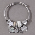 Silver stainless steel charm bracelet with pearls, heart pendants, and angel wings charms - White