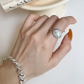 Silver open ring with oval white gemstone on model hand with chain bracelet - Oval White Stone Ring Bracelet Set (J4116)