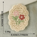 Handmade crochet cherry flower embroidery patch in beige with pink and red floral details - Oval Flower