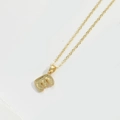 Minimalist gold necklace featuring a textured letter E pendant on a delicate chain - Letter E