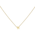 Detailed view of an 18K gold letter M pendant on a delicate cable chain necklace - Gold M