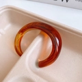 Close-up of gold-plated mother-of-pearl bangle with amber tortoiseshell resin texture - No. 26 Thick C-Shaped Amber Color Bangle