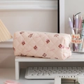 Pink quilted pencil case with cute bear patterns and Lalala print on desk shelf - Bear