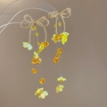 Detalle de pendientes de mariposa dorados con flores de cuentas amarillas y borlas largas - Lazo de Cuentas de Semilla Oro Borla Amarilla (18# Aguja de Plata-Amarillo)