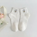 White cotton mid-calf socks featuring a cute cartoon animal embroidery on a white background - Cream Black Dog (8002)