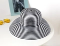 Close-up of black and white striped straw sun hat on table with vintage sunglasses - Adjustable / Black & White Stripes
