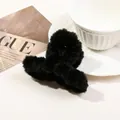 Fuzzy black plush claw clip for hair shown with a stylish magazine background - 9cm Plush Cross - Black