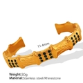 Golden bamboo style open cuff bracelet with green rhinestones and 11.4mm width - Gold with Green Stone