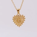 Gold stainless steel heart pendant necklace featuring embossed beads and letter G - G (With Chain)
