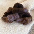 Detail shot of the plush lamb wool texture on this elegant brown and purple hair scrunchie - Coffee/Purple