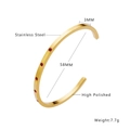Detail of high polished 18k gold plated stainless steel C-shape bangle with red zircons - Gold with Red Rhinestone