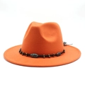Detail of orange wool fedora featuring a black braided band with vintage bronze beads - Orange