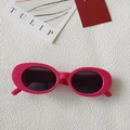 Retro rose pink oval frame sunglasses with dark lenses on white leather background - Oval Frame / Pink Purple