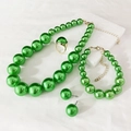Detailed view of elegant green faux pearl jewelry set with gold finish necklace and earrings - Green