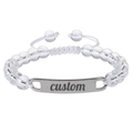 Detailed macro of a custom engraved metal bar on a beaded adjustable stone bracelet - Clear Quartz