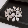 Silver vintage floral bracelet with grid texture and crystals on black velvet display - Silver Hollow Grid Flower Bangle (65#)