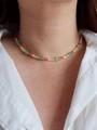 Close-up of a colorful beaded necklace with gold spacers worn on a white shirt - Lobster Clasp Orange Yellow Cat's Eye 38+5cm
