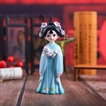 Chinese court style doll figurine in light blue robe holding a white cat - 1218-2C Medium Holding Cat