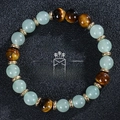 Macro detail of tiger eye and turquoise beads wealth bracelet on black texture - Tiger Eye Aventurine Style (Wealth-3)