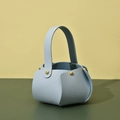 Detail of light blue PU leather gift bag with metal rivets and elegant stitched handle - Light Blue (Pack of 10)