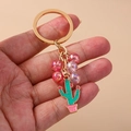 Detailed view of pastoral beaded cactus keychain with pink beads and golden ring - Pink Cactus